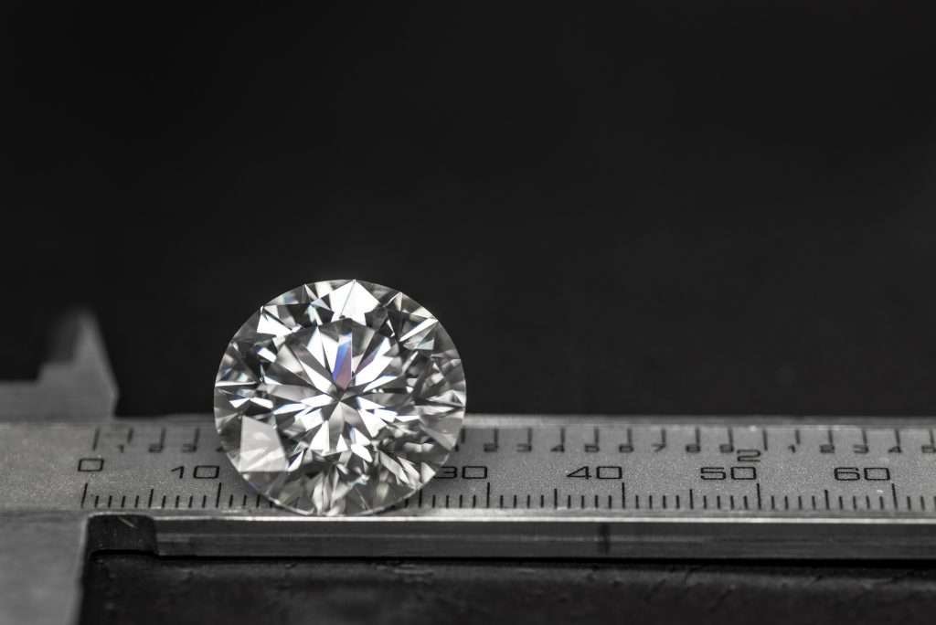 Diamond being measure on a black background