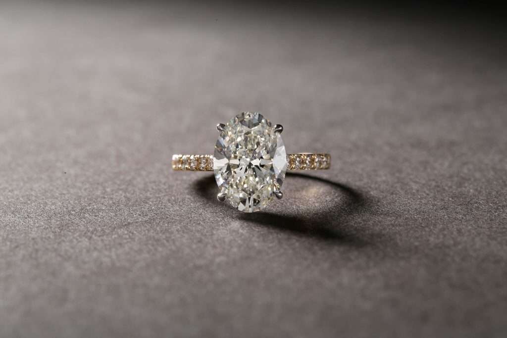 Engagement ring sitting on flat surface