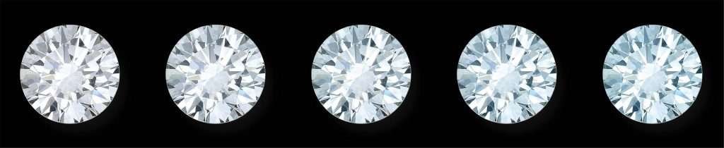 Round diamonds in a row with greater and greater degrees fluorescence.