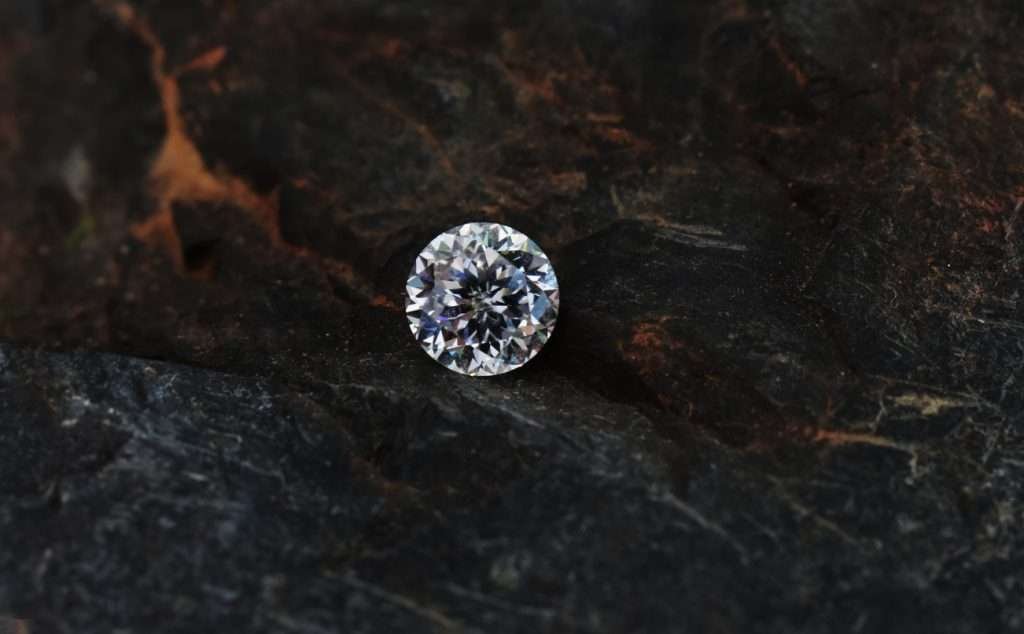 Diamond resting on shale rock.
