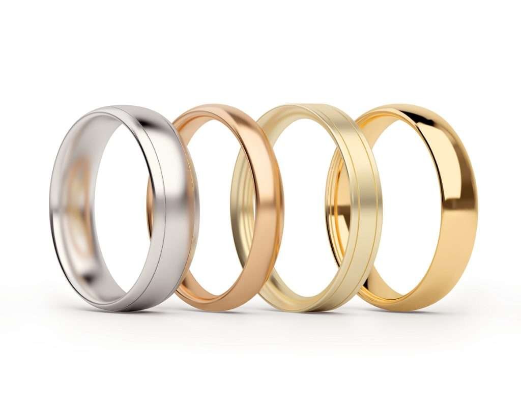 Gold rings in white and yellow gold in a horizontal format, one next to the other.