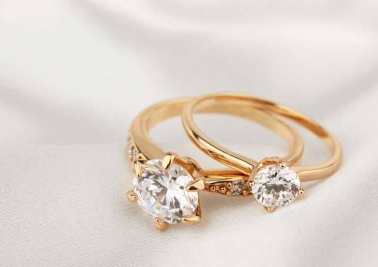 Gold jewelry rings with diamond on white cloth