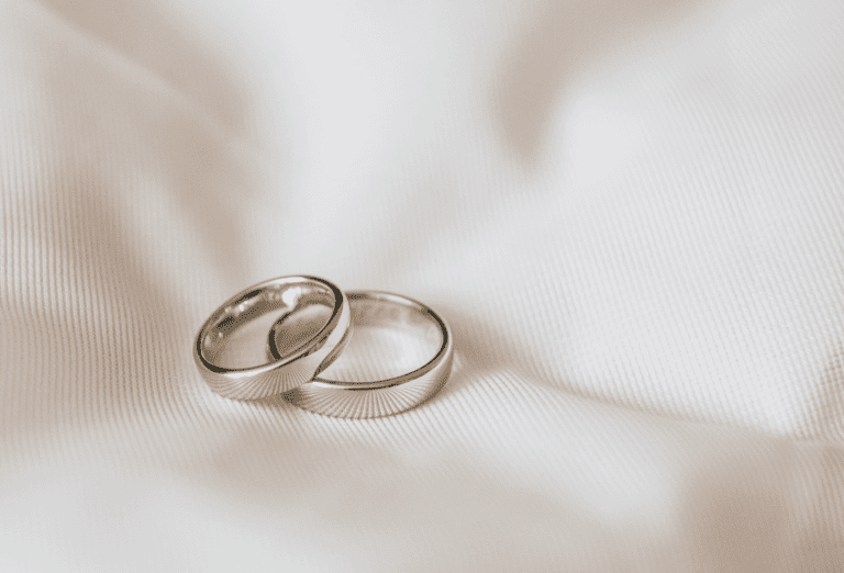 Platinum ring on a white satin fabric
