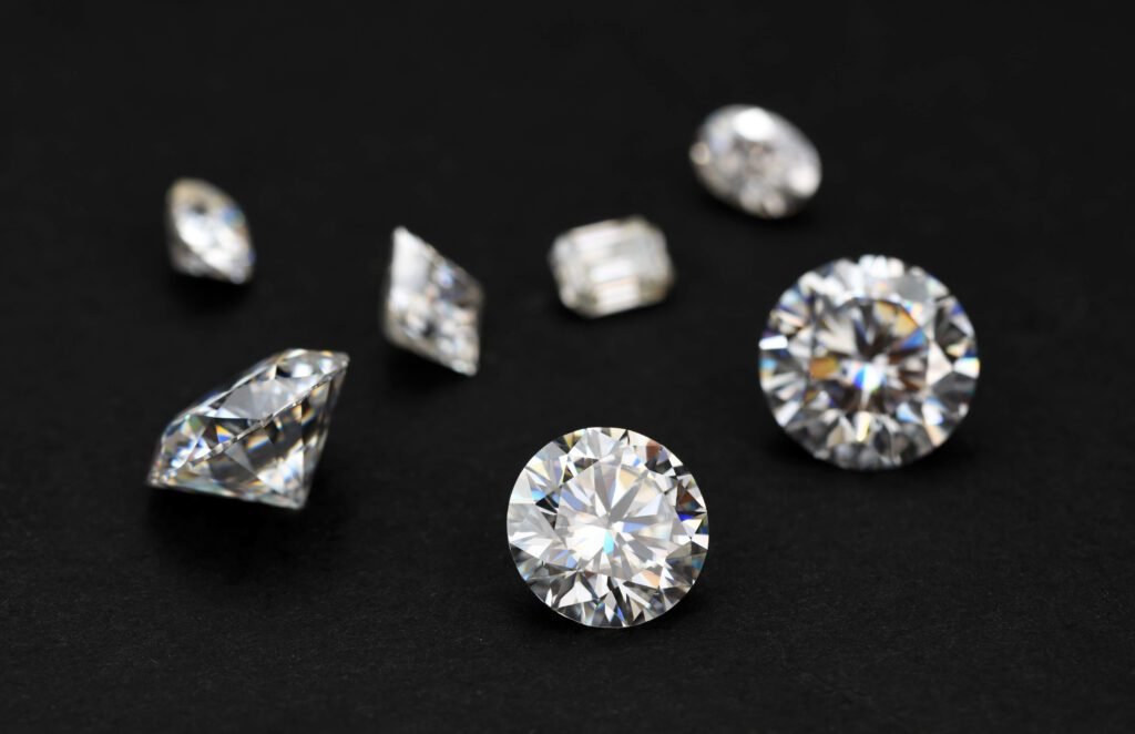 Loose diamonds in a dark background